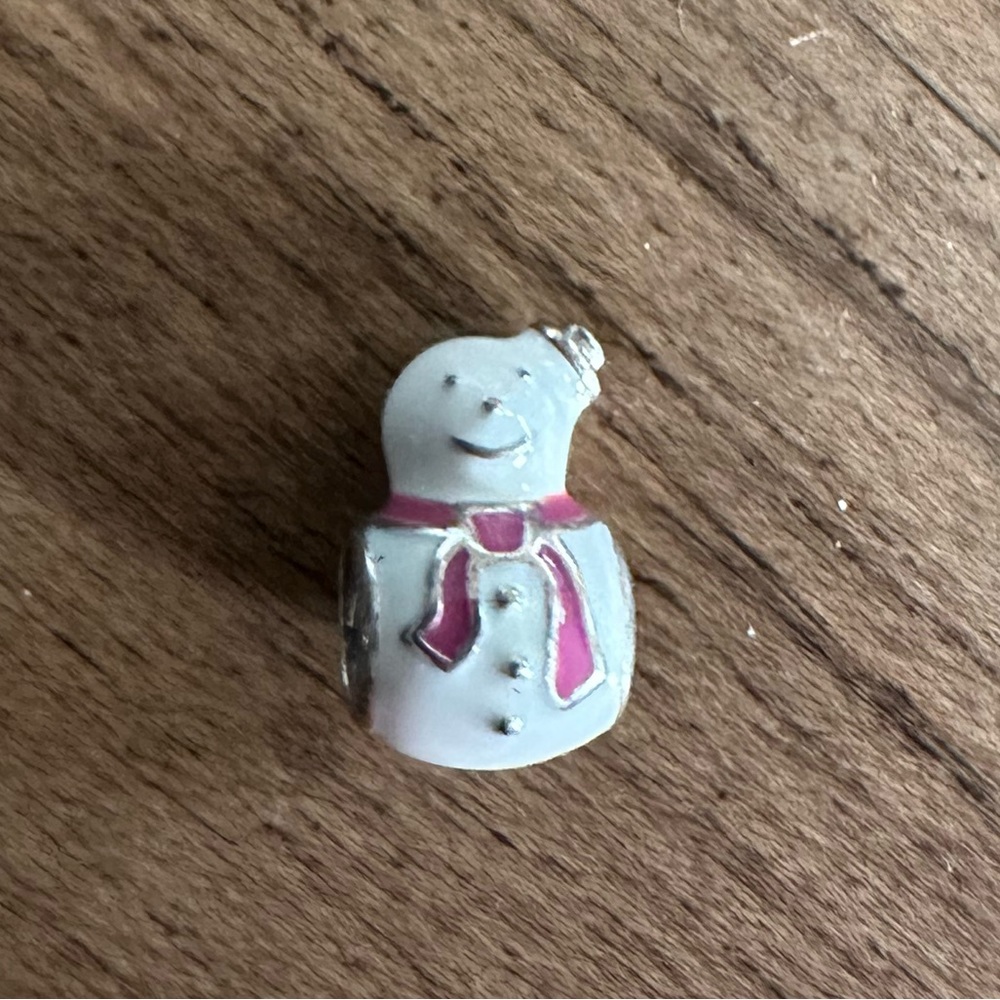 Authentic Pandora snowman charm.